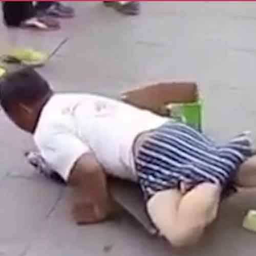 Beggar busted faking his disability after a passerby dragged off his trousers