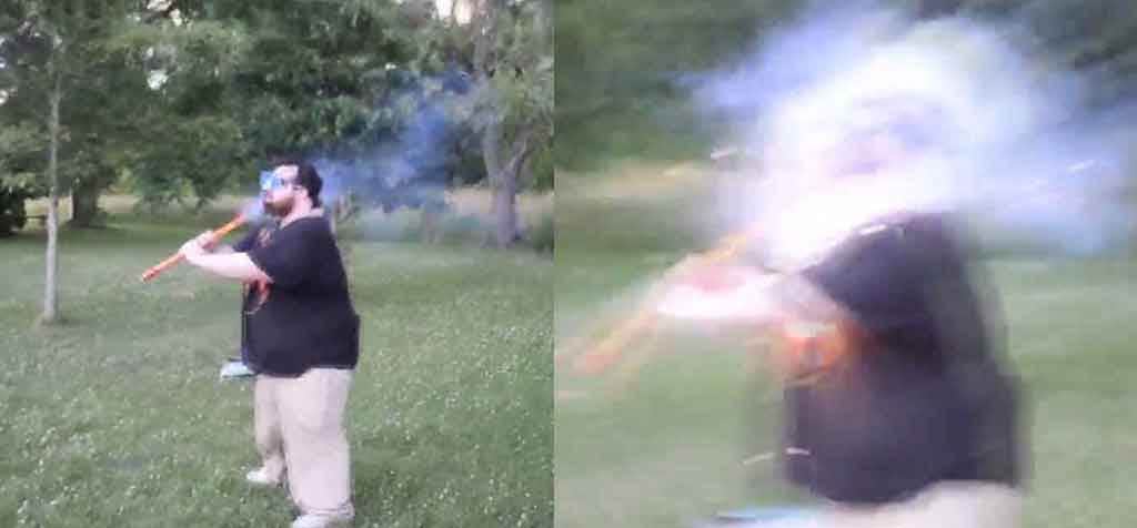 Idiot lights firework under his chin 