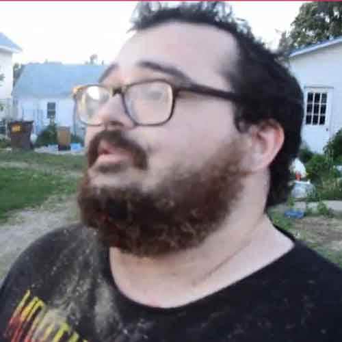 Idiot lights firework under his chin 