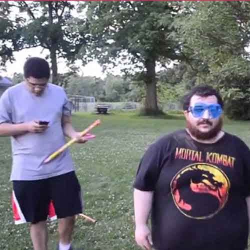 Idiot lights firework under his chin 