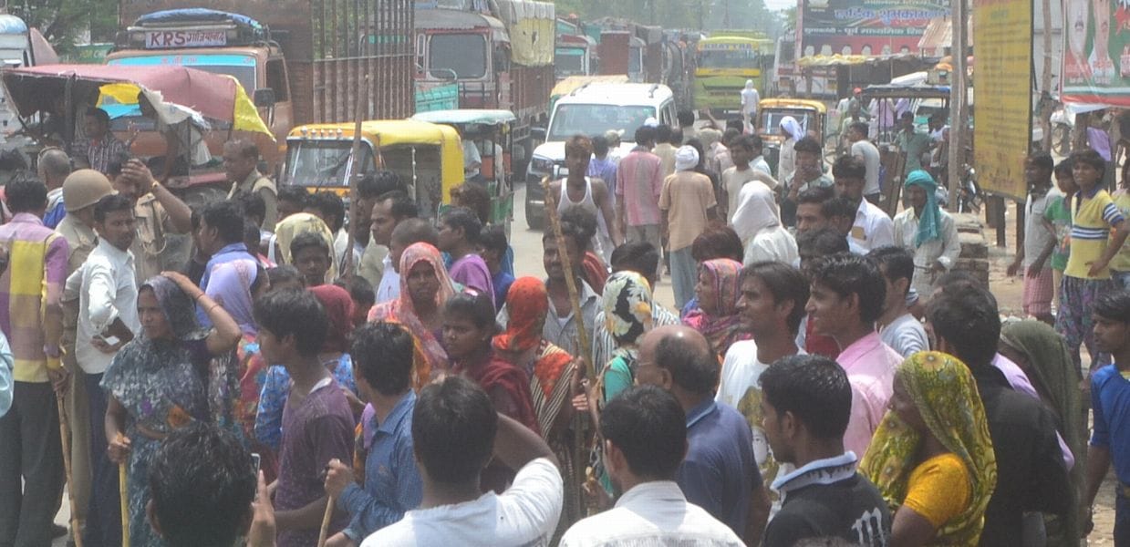 Businessman robbed by highway jammed with angry traders
