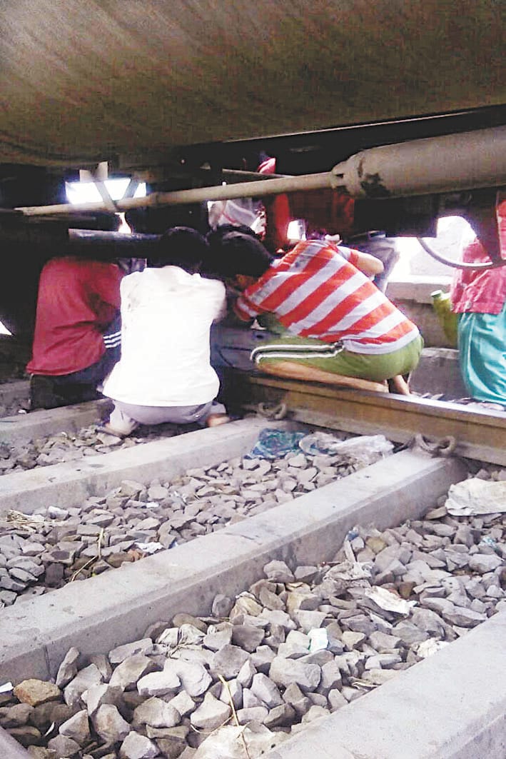 Petrol tanker train leak, filling people take