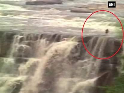 Rising water level washes away one person at waterfall 
