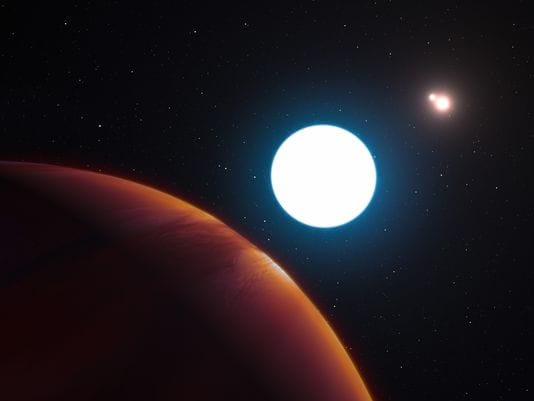 Massive planet with three suns discovered