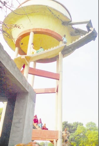 family climber on water tank
