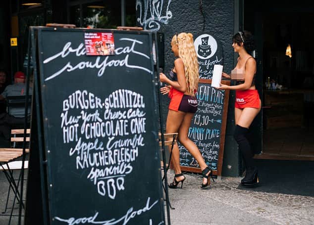 Exhibitionists flock to nude restaurant where staff and guests bare all.