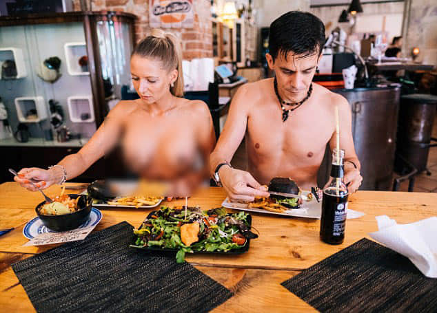 Exhibitionists flock to nude restaurant where staff and guests bare all.