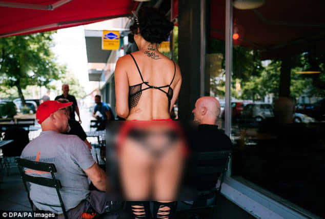Exhibitionists flock to nude restaurant where staff and guests bare all.
