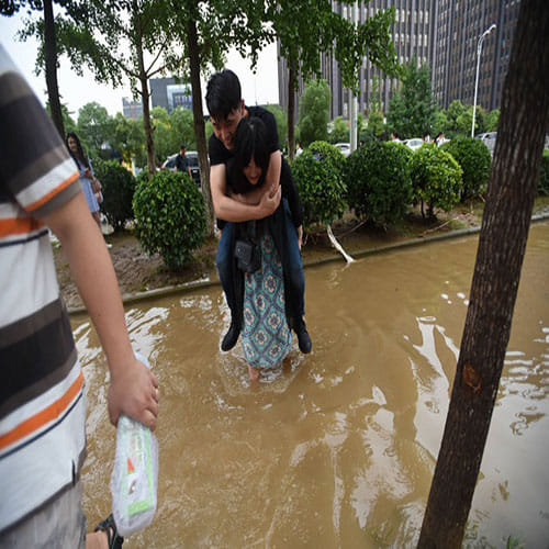   girlfriend treks with boyfriend on her back to save his shoes