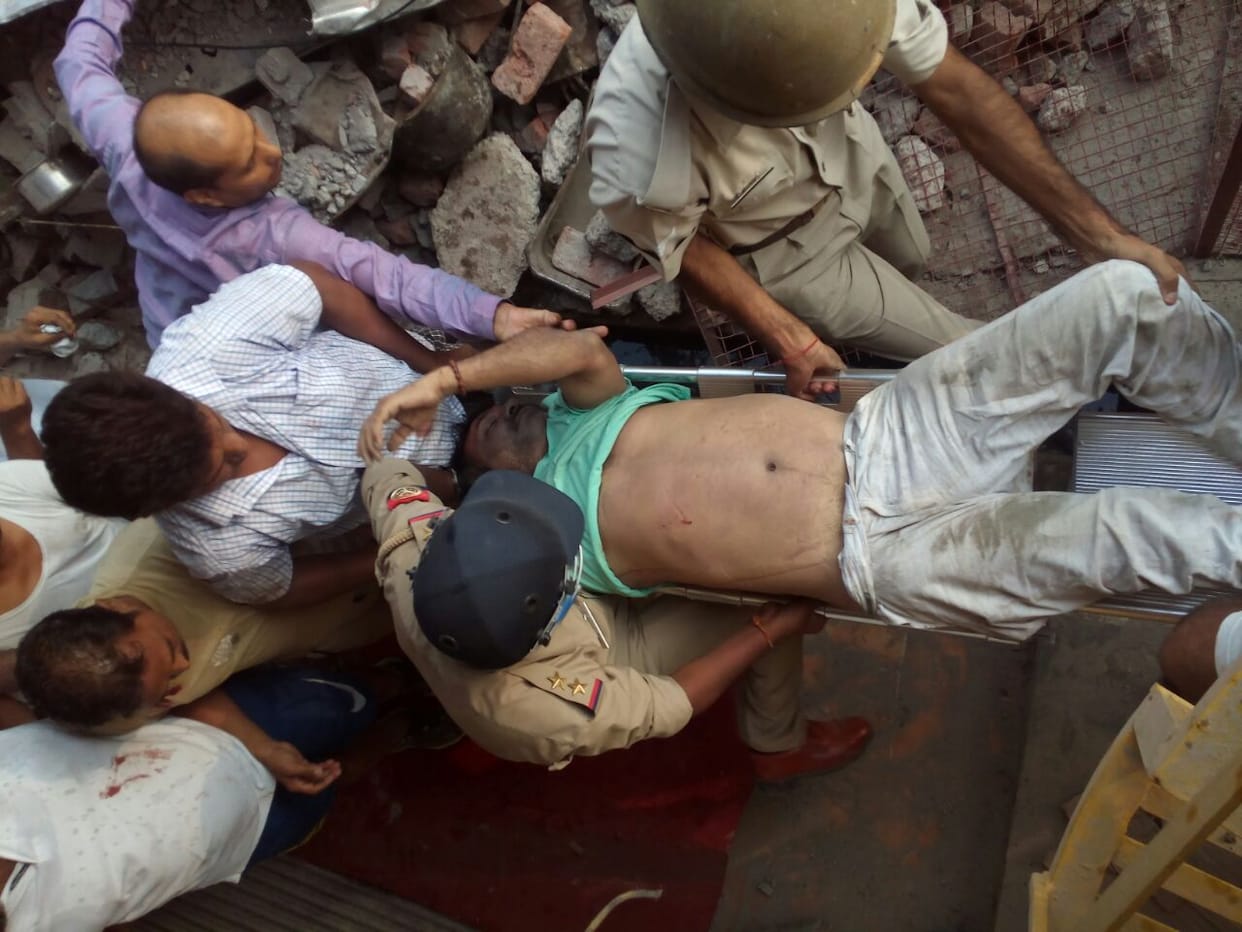 one collapsed pushed under garbage  
