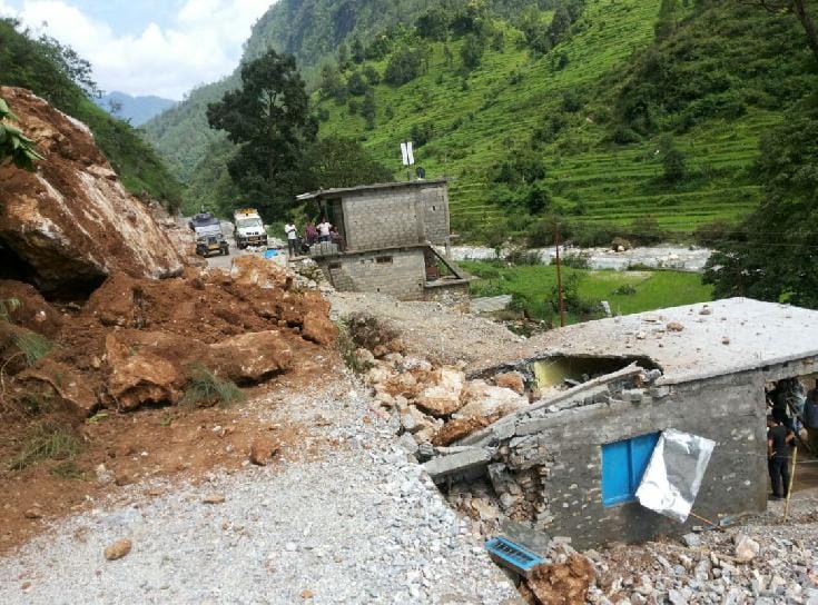 Houses broken by falling boulder