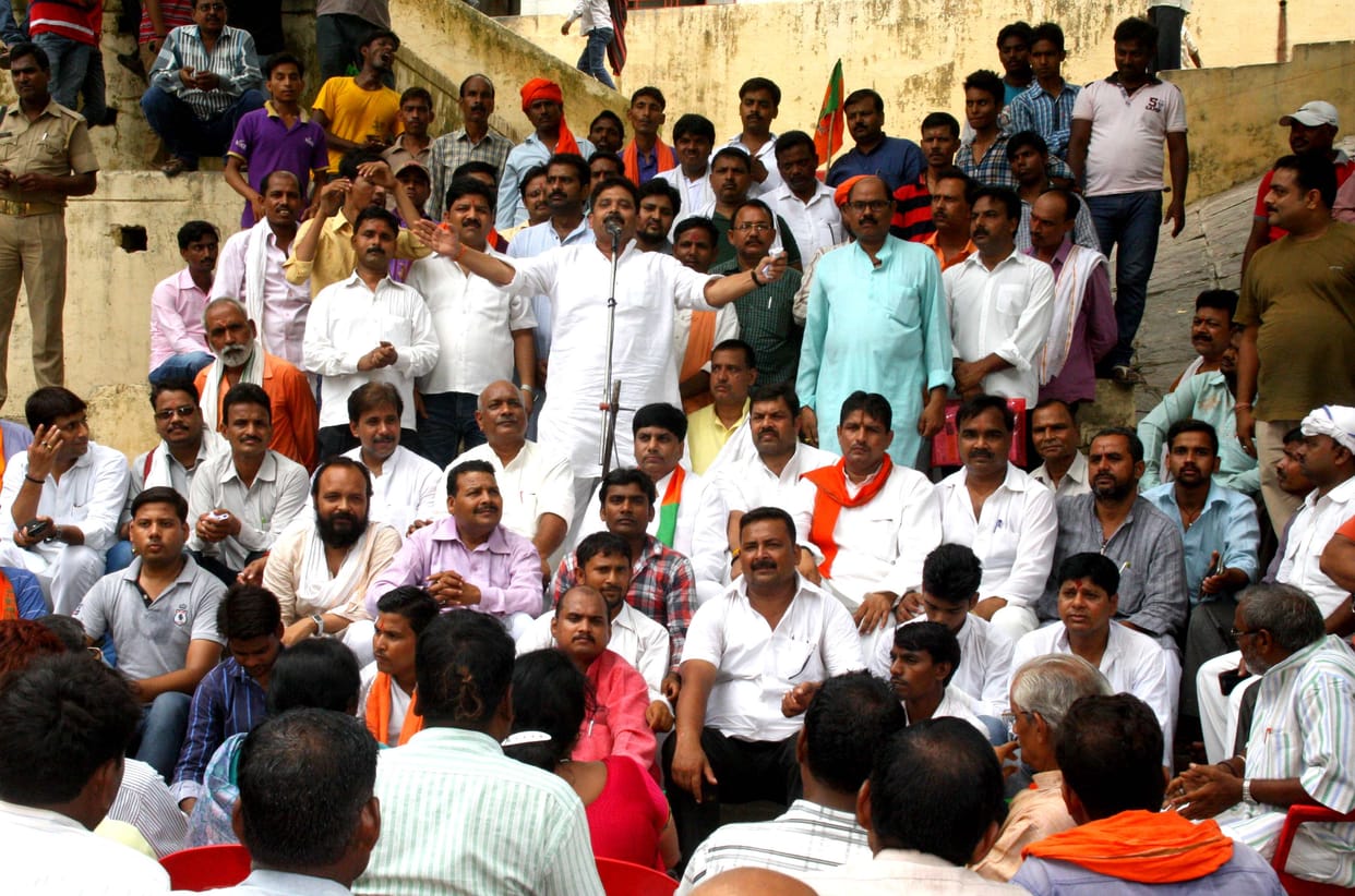 The BJP members shout at police stations