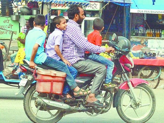 Sir! Helmet to the head, not to bike