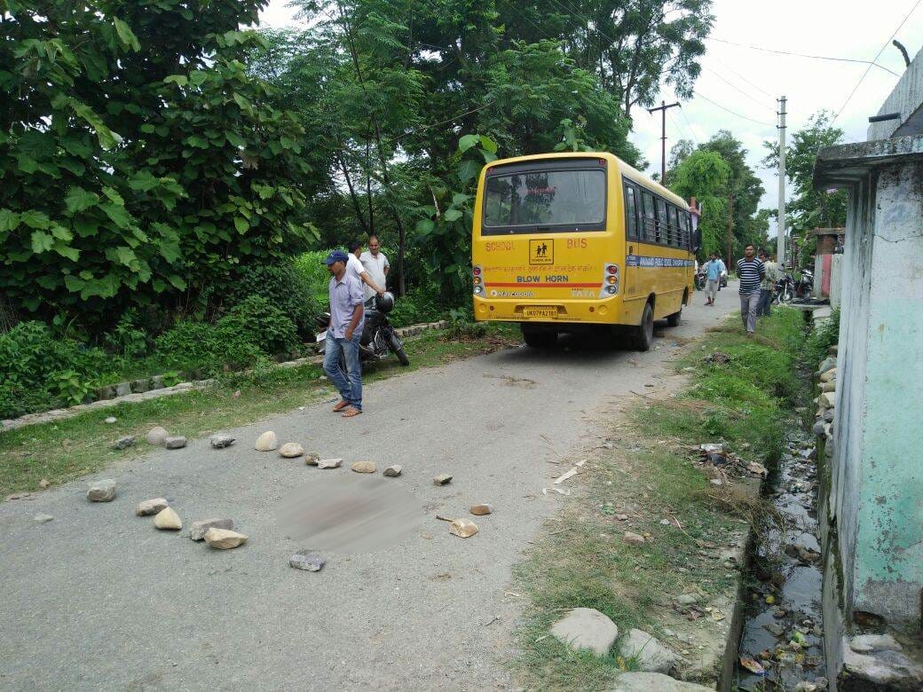 child crushed by school bus, death