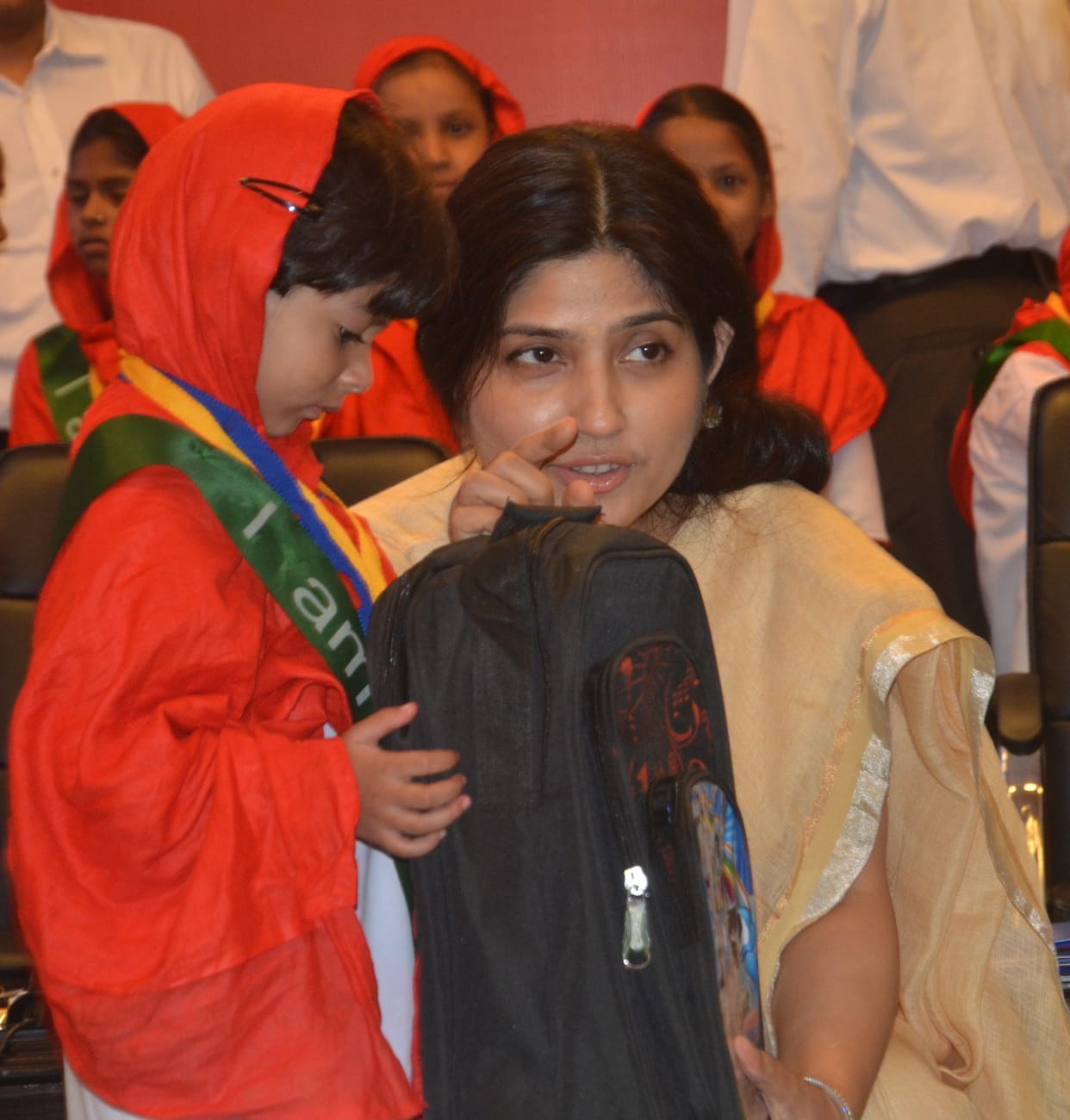 dimple yadav distributes school bags on malala day