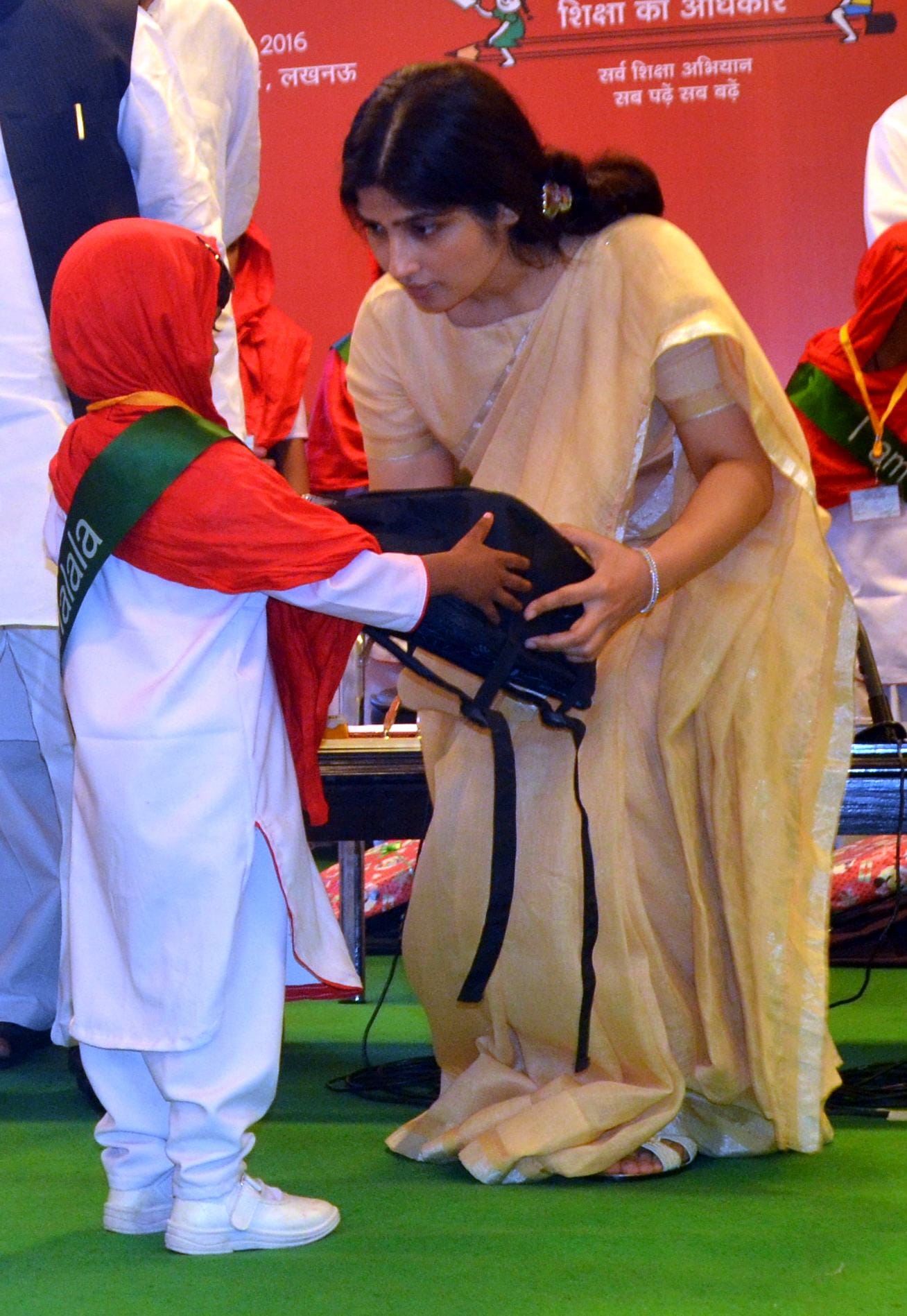 dimple yadav distributes school bags on malala day