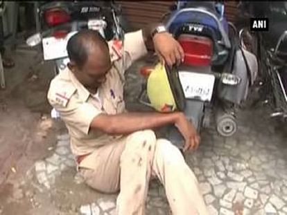Watch: 'Drunk' policeman falls on road