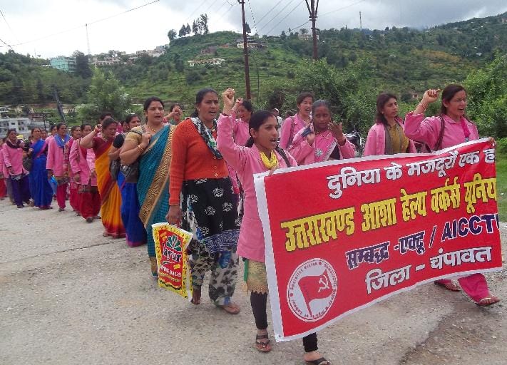 procession pulled by asha workers