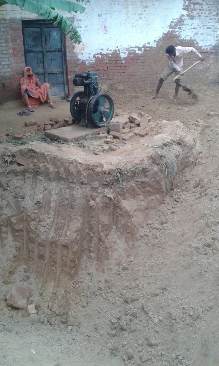 two men buried under mound rescuing buffalo