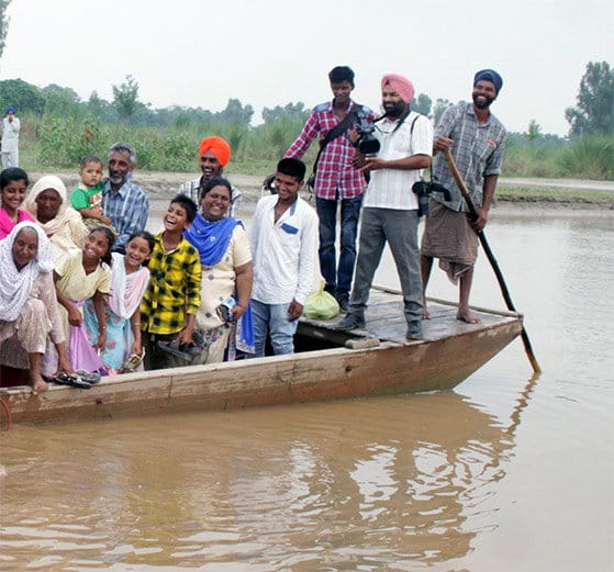 amazing love, groom lift up bride in arms to cross the beas river in jalandhar of punjab