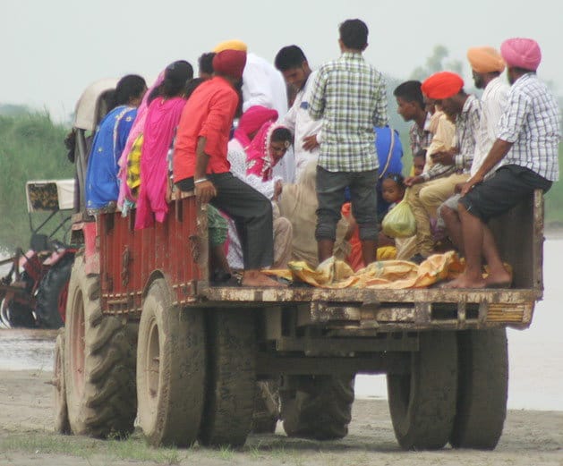 amazing love, groom lift up bride in arms to cross the beas river in jalandhar of punjab