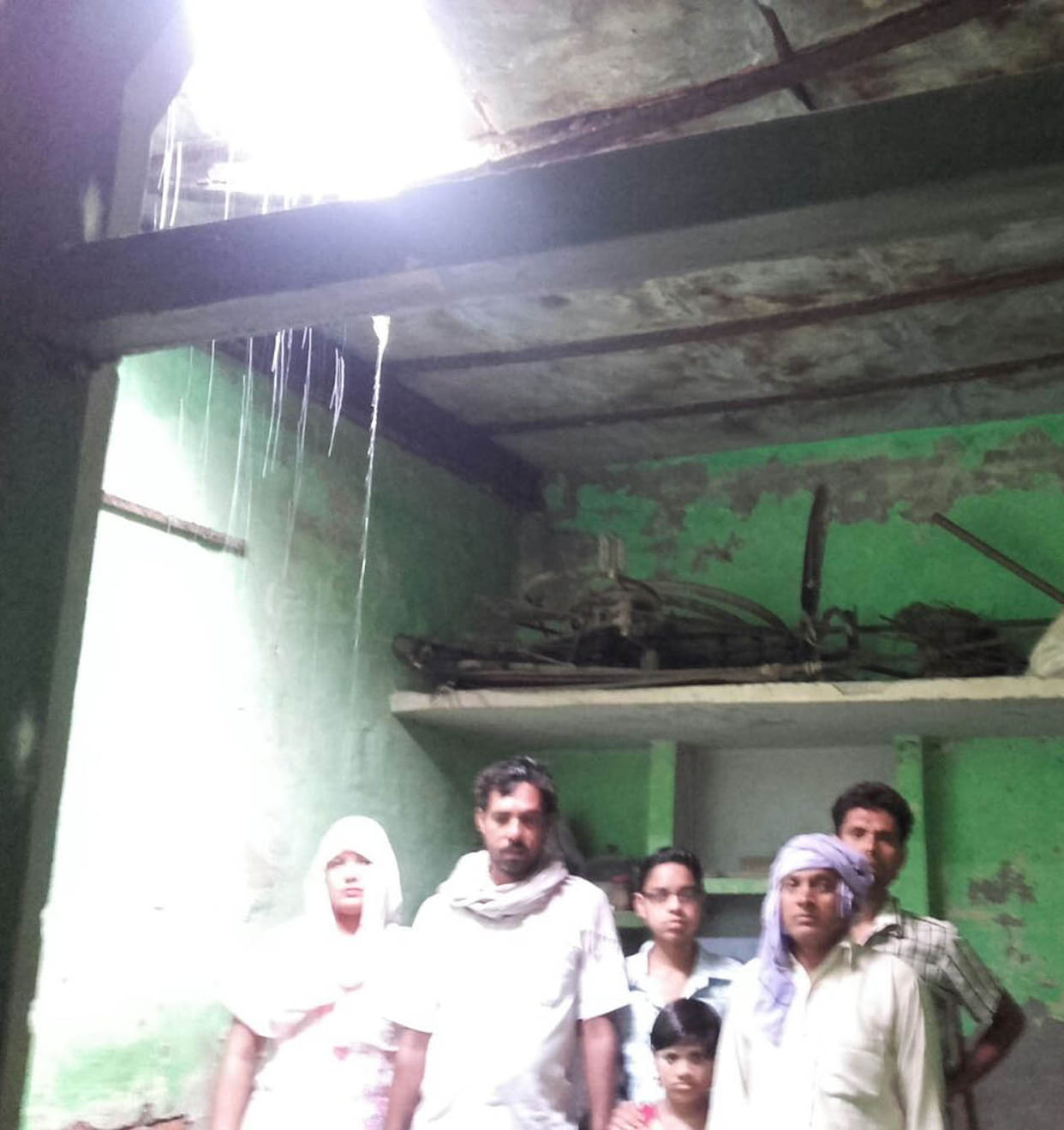 Rain fell from the roof of the house.