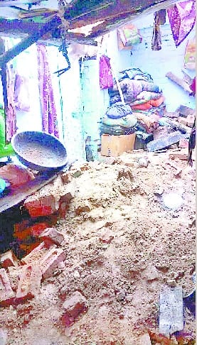 The roof of the house collapsed , killing two women