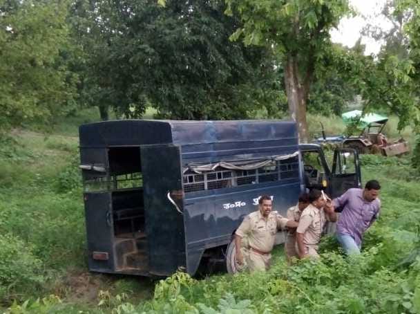 Upturned car, injuring seven policemen