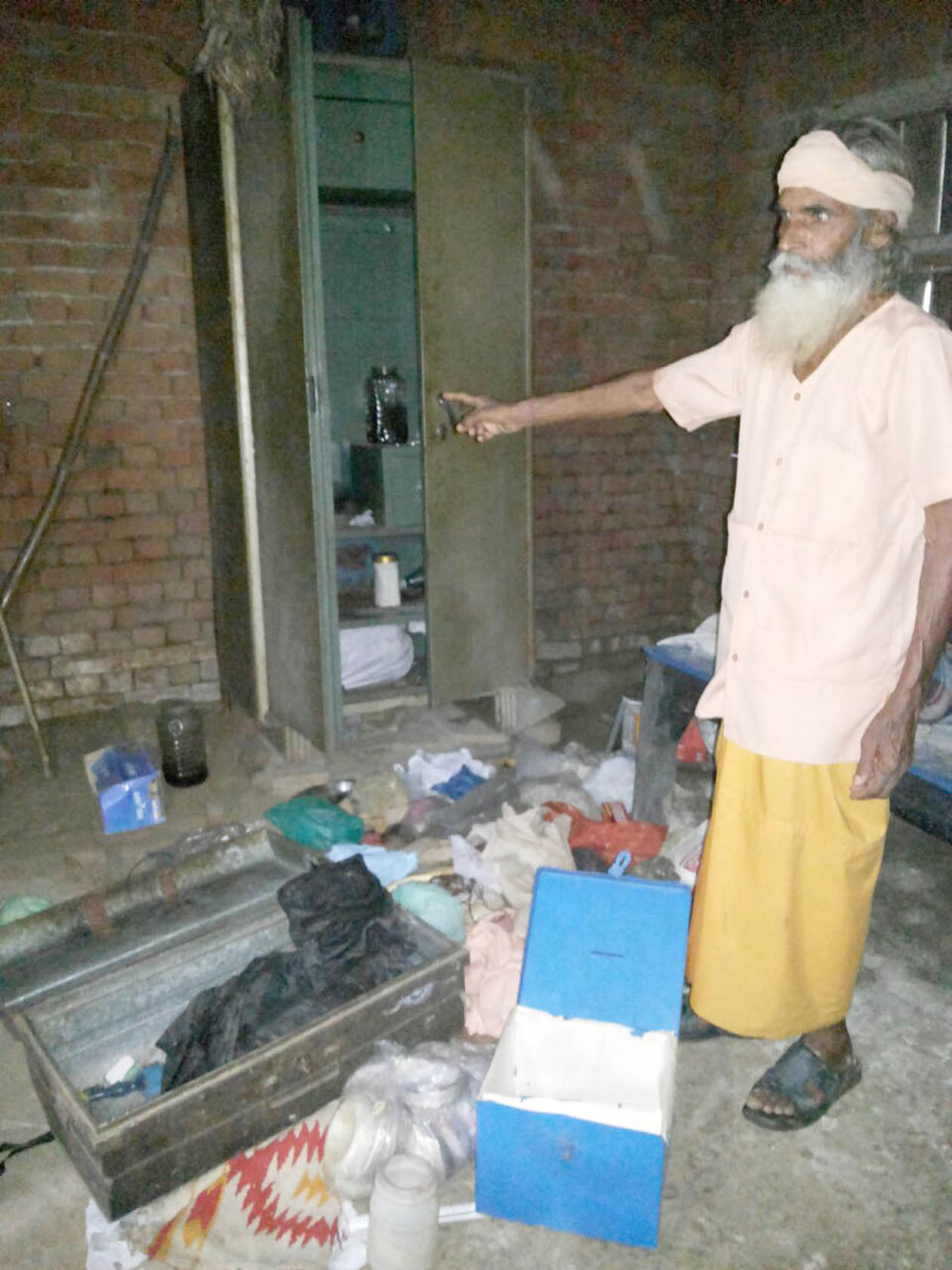 Priest hostage looted cash and goods.