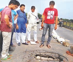 Cracks in Townes bridge, a hole on road  