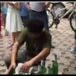 Chinese man breaks beer bottles in half with bare hands