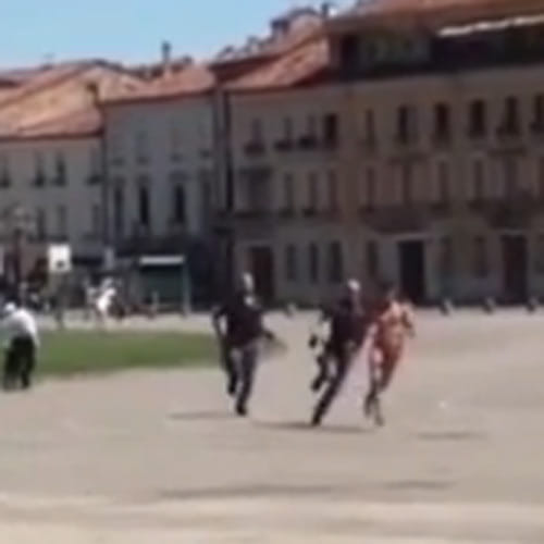 naked man shouting 'Praise to Allah' made police runaround the town square
