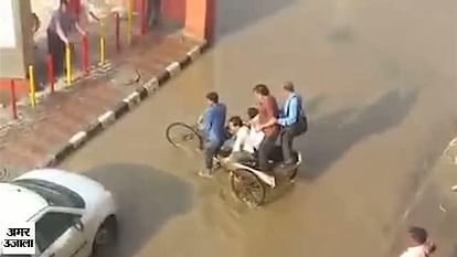 Water logging at Mundka metro station gives business opportunity to rickshaw puller