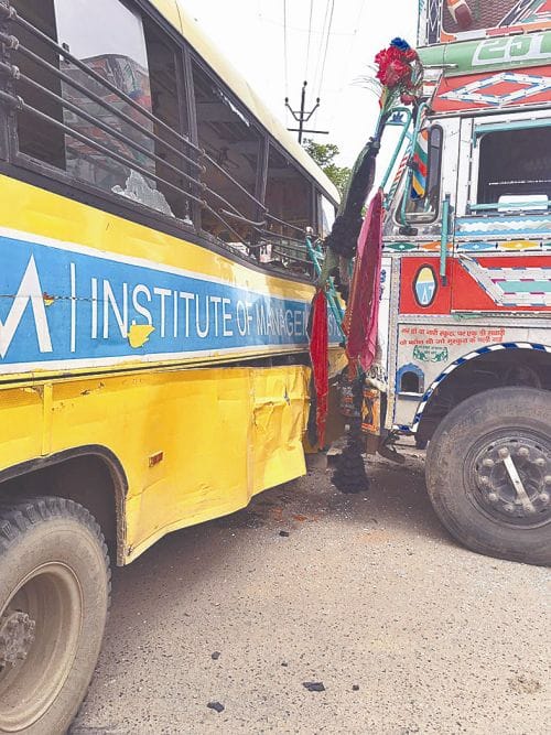 Truck collides with a bus full of students