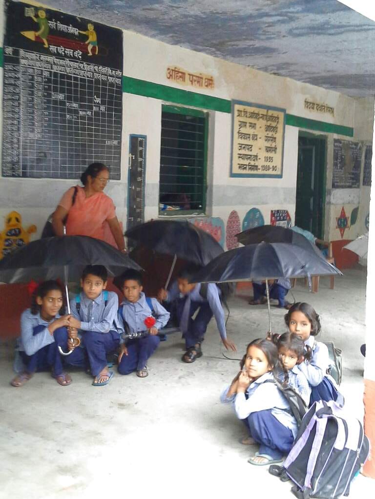 Leaking roof, umbrella child with reading