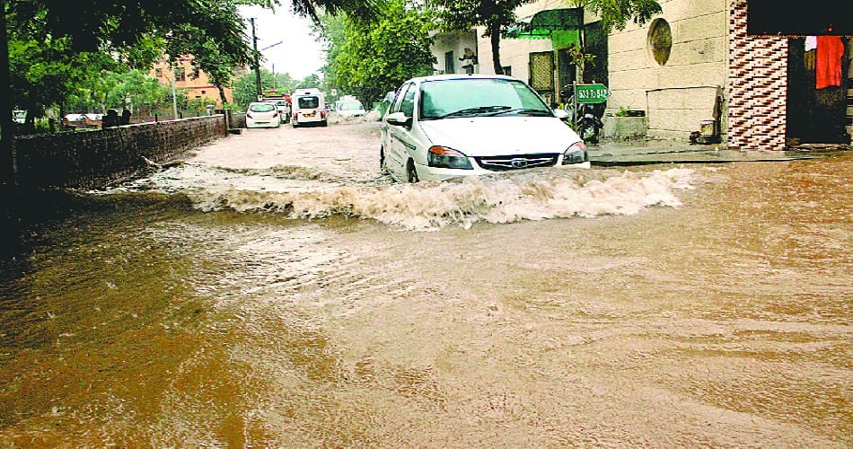 havoc of Rain, park and road immersed into pond