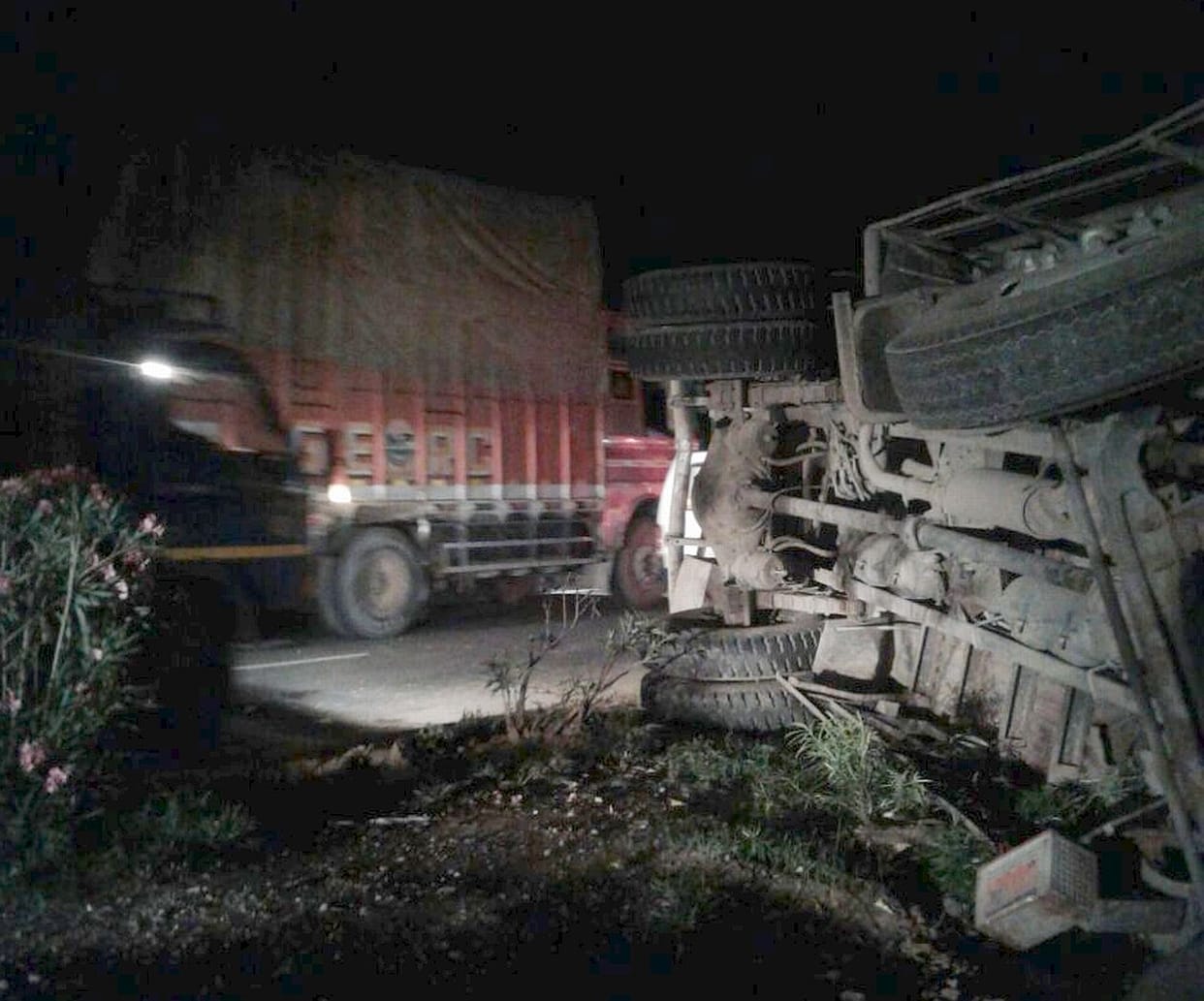 Canter truck overturns side nine injured