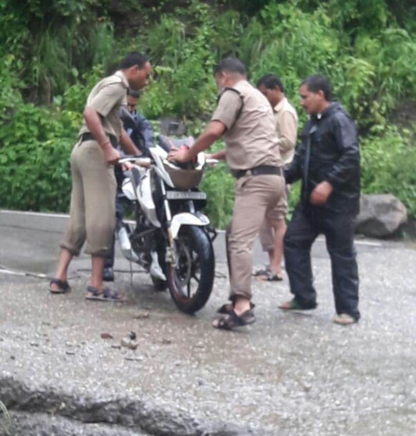 man washed away with bike in flood.