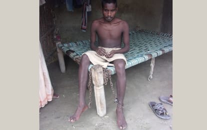 woman controls his son with shackle