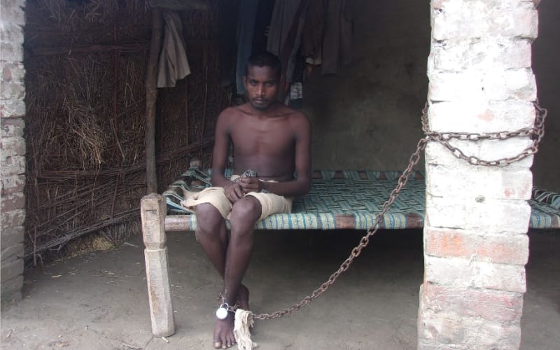 woman controls his son with shackle