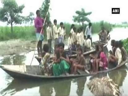 Severe flood forces children to go to school on boats