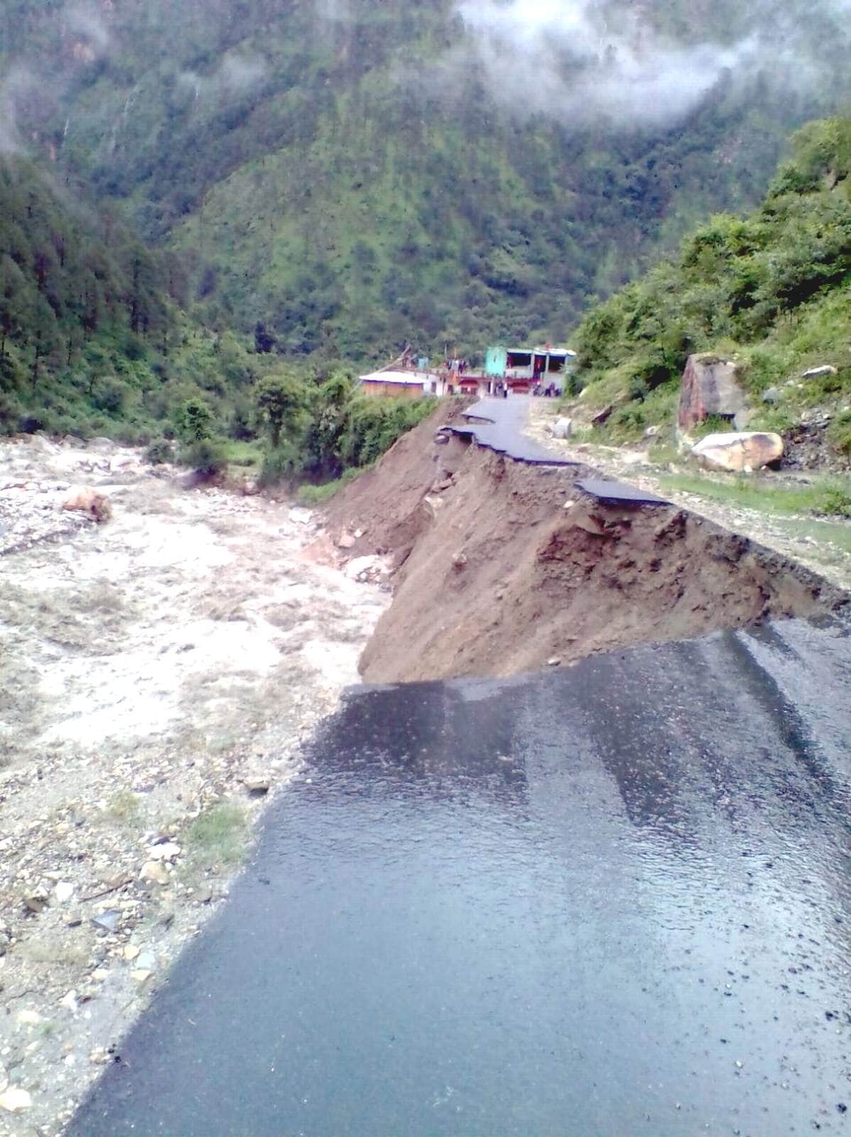 roads washed away in uttarakashi due heavy rain.