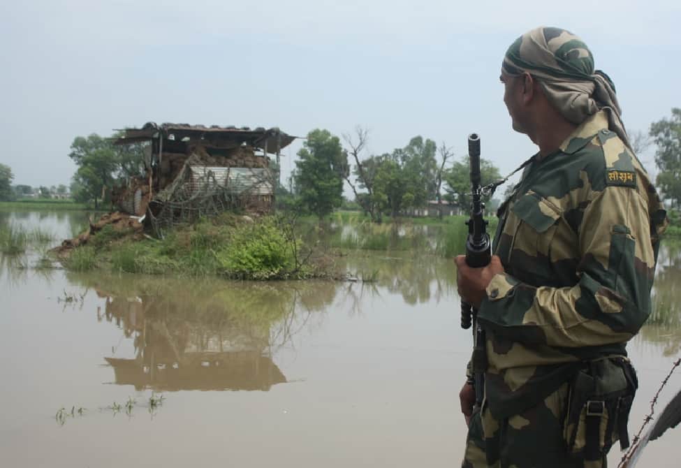 soldier trying to removing water from posts