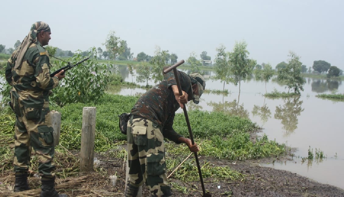 soldier trying to removing water from posts