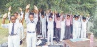 A teacher, is teaching children with cleaning the toilet, Baban, Kurukshetra