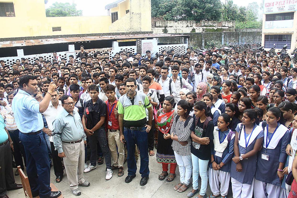 Das College against hooliganism The staff seated sitting on dharna