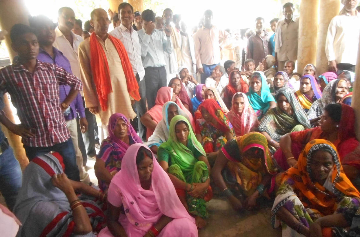 women agitated against cota shop reallotment