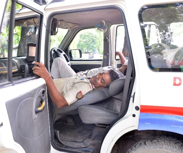  Police men sleeping on duty.