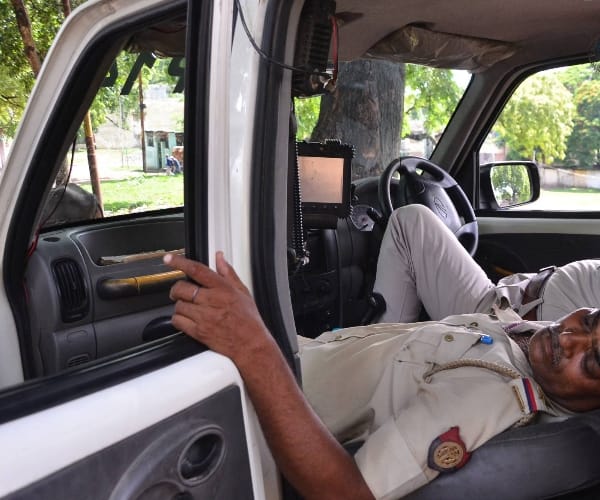  Police men sleeping on duty.