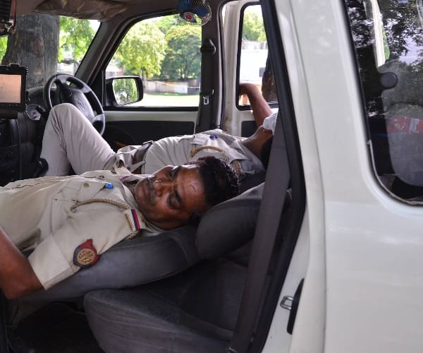  Police men sleeping on duty.